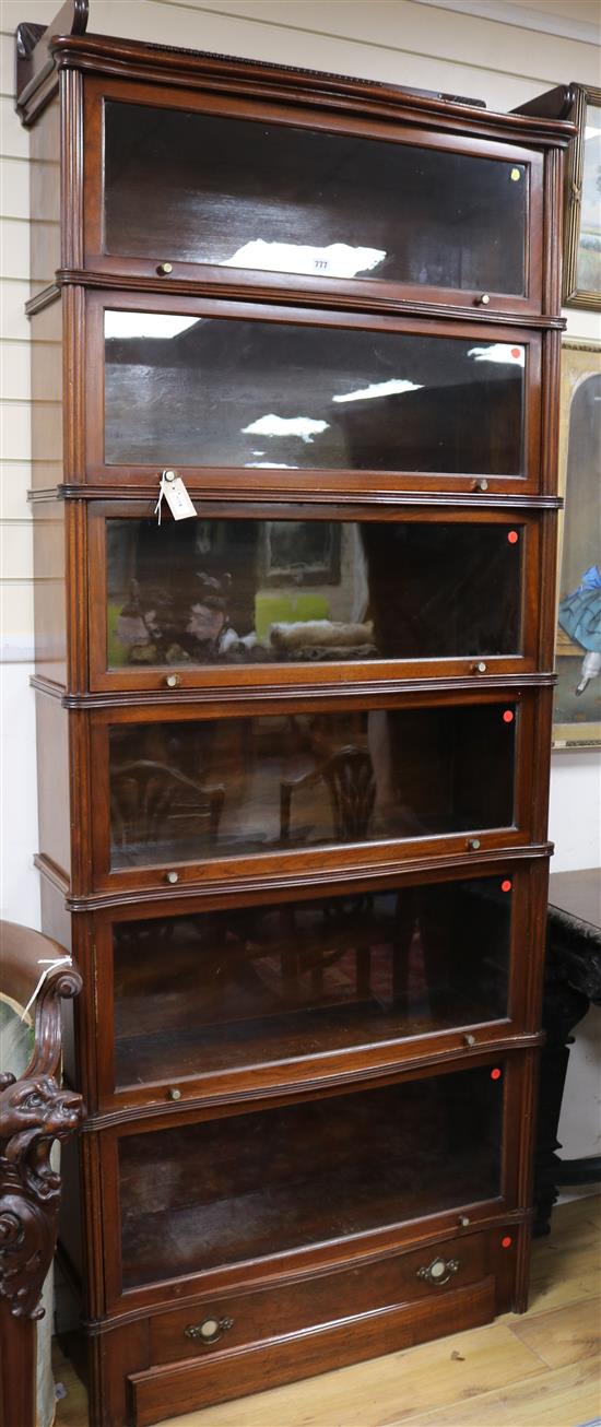 A Wernicke System Elastic serpentine mahogany six section bookcase, c.1895 W.91cm